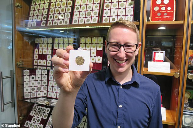 Numismatist Matthew Thompson from Town Hall Coins and Collectables with a rare double-stamped $2 coin that is worth $3000 due to a mistake by the mint during manufacturing