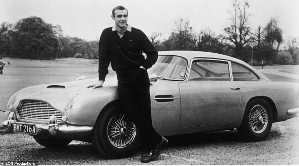 Ray Massey took to the wheel of one of Aston Martin's £3.3m Goldfinger continuation cars equipped with the gadgets from the iconic Sean Connery film seen here