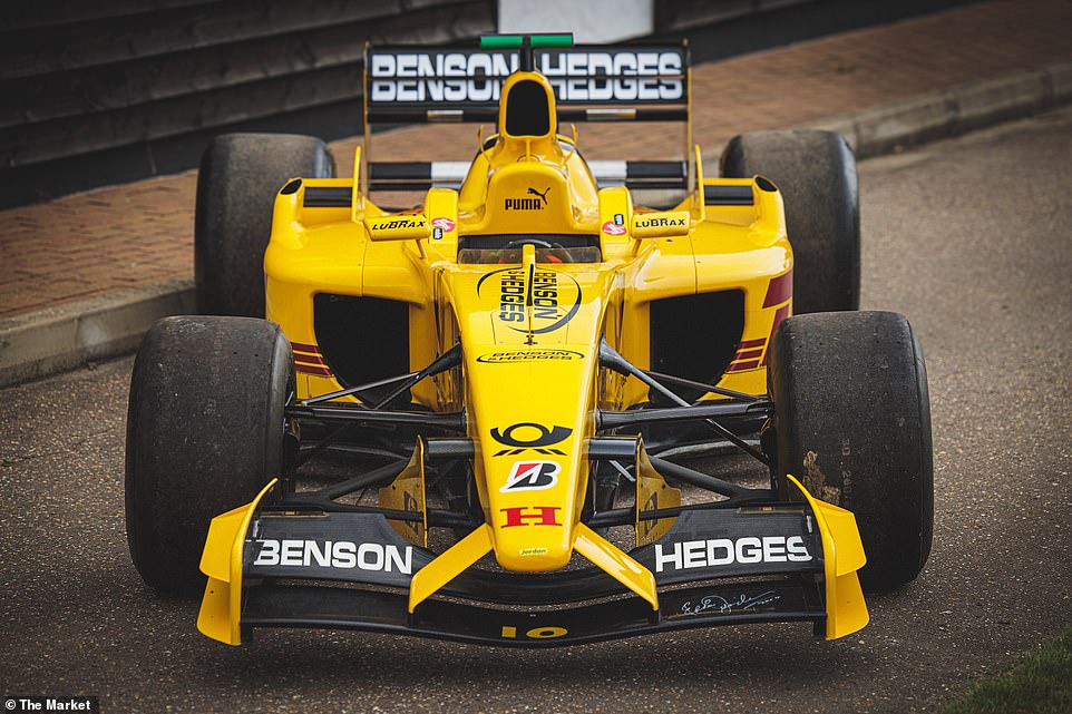The F1 car still sports its DHL-sponsored yellow exterior and original ‘Suzuka Legend’ livery from the 2002 season