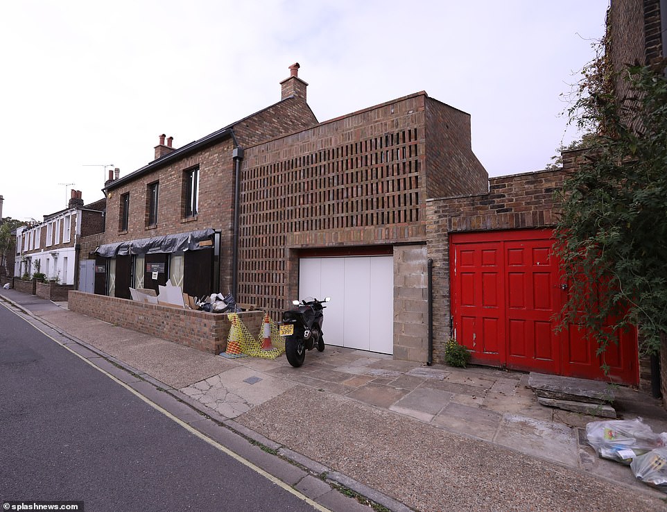Recent pictures of the site show that it is still decked out with numerous building materials despite brand new glass and brick facade on show