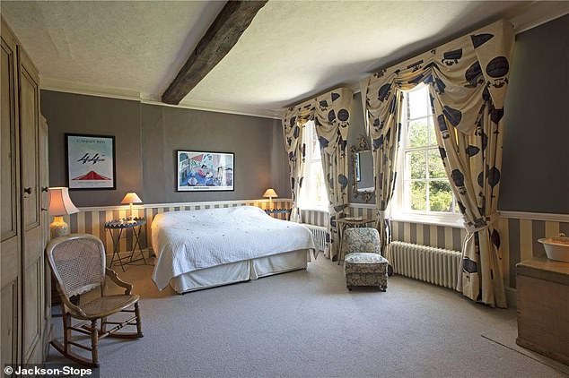 The house extends across three levels, with five bedrooms and period features