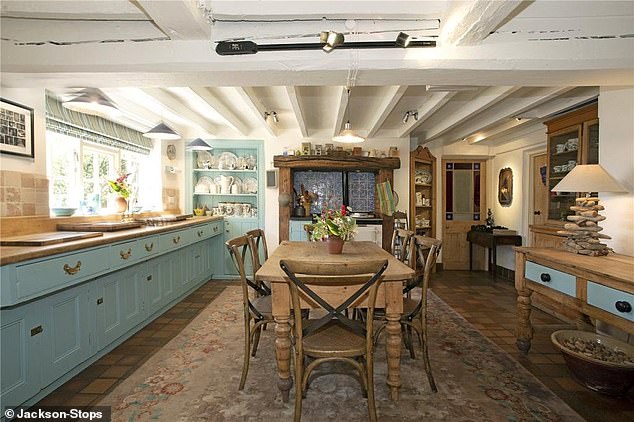 It's entertaining! The colourful kitchen has a country cottage with an Aga oven
