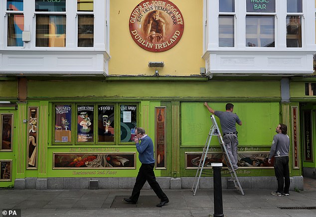 There still needs to be a recognition of how fragile the recovery could be and how easily it could be knocked off course should the nation be locked down again, even for a temporary period. Pictured: Windows of a pub in Dublin's Temple Bar are boarded up, as further restrictions in Dublin were imposed on Friday