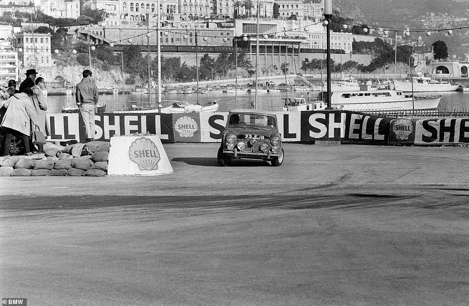 Hopkirk photographed taking a hairpin turn at the harbour in Monte Carlo with spectators within metres of the action