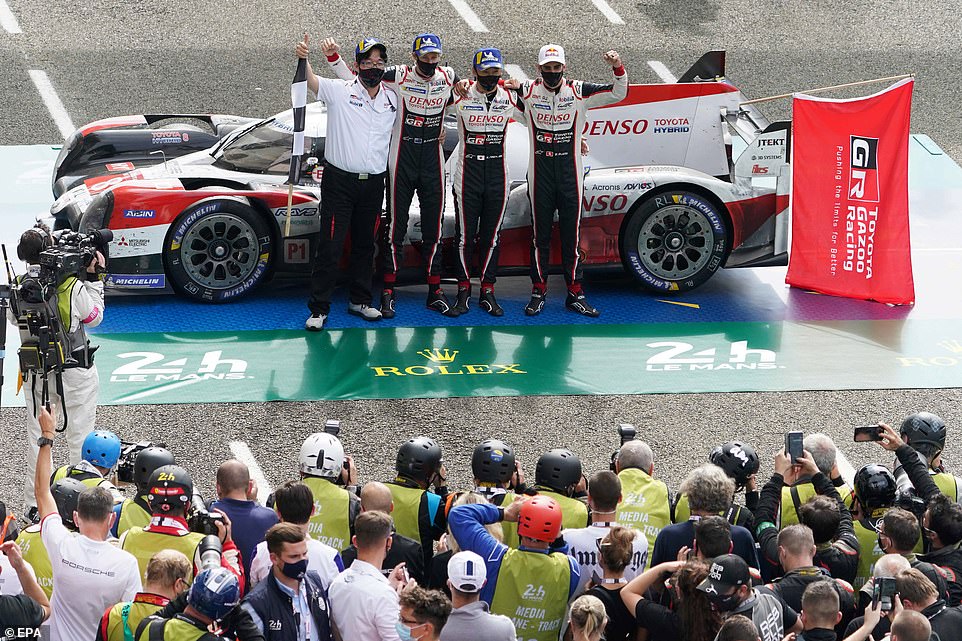 Takio Toyoda Team Chairman (far left) and drivers (left to right) Sebastien Buemi of Switzerland, Kazuki Nakajima of Japan and Brendon Hartley of New Zealand celebrate in front of their Toyota TS050 Hybrid race-winning car at the Le Mans 24 Hours race in Le Mans. The road-going Super Sport will be inspired by this very machine