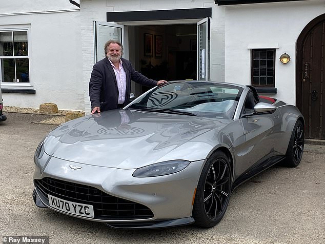 Ray Massey poses with the £127,000 Aston Martin ahead of our first drive in the top-down sports car