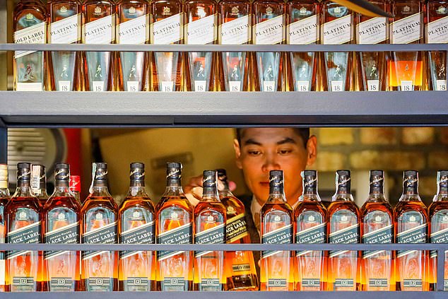 Drinking to success: The drinks business said it has been buoyed by 'robust demand' in the off-trade, which covers supermarkets and retail stores