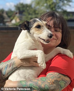Victoria Patterson hugs her dog