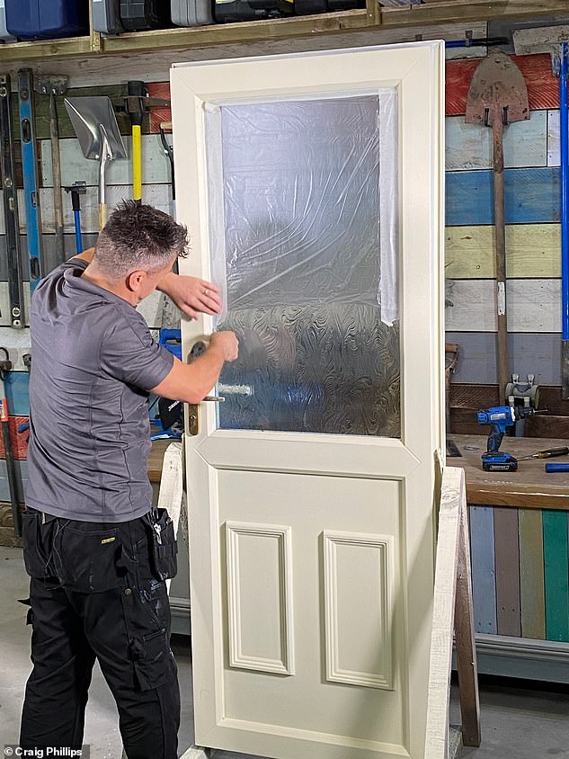 Pictured: Craig prepares his discoloured white plastic door for spray painting