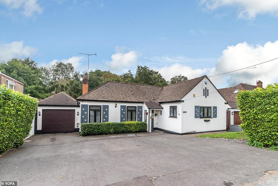 This four-bedroom bungalow for sale looks ordinary from the front but hides an attractive feature at the rear