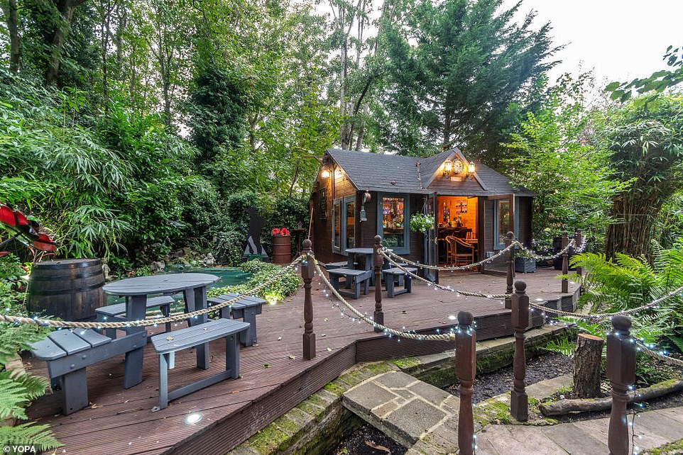 There is a hidden landscaped area at the rear of the bungalow with its own pub and an elaborate pub garden