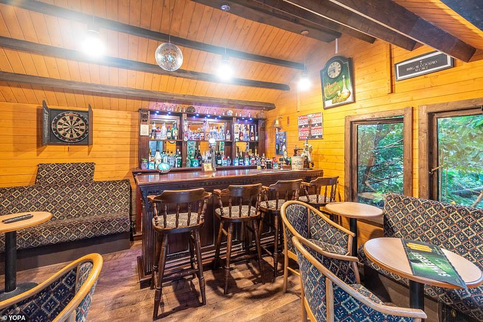 One hundred and eighty! Inside of the outbuilding is a bar and seating areas, along with a darts board and a 'final orders' bell