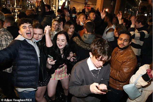 An impromptu party on Church Street in Liverpool on the last weekend before stricter lockdown measures are expected