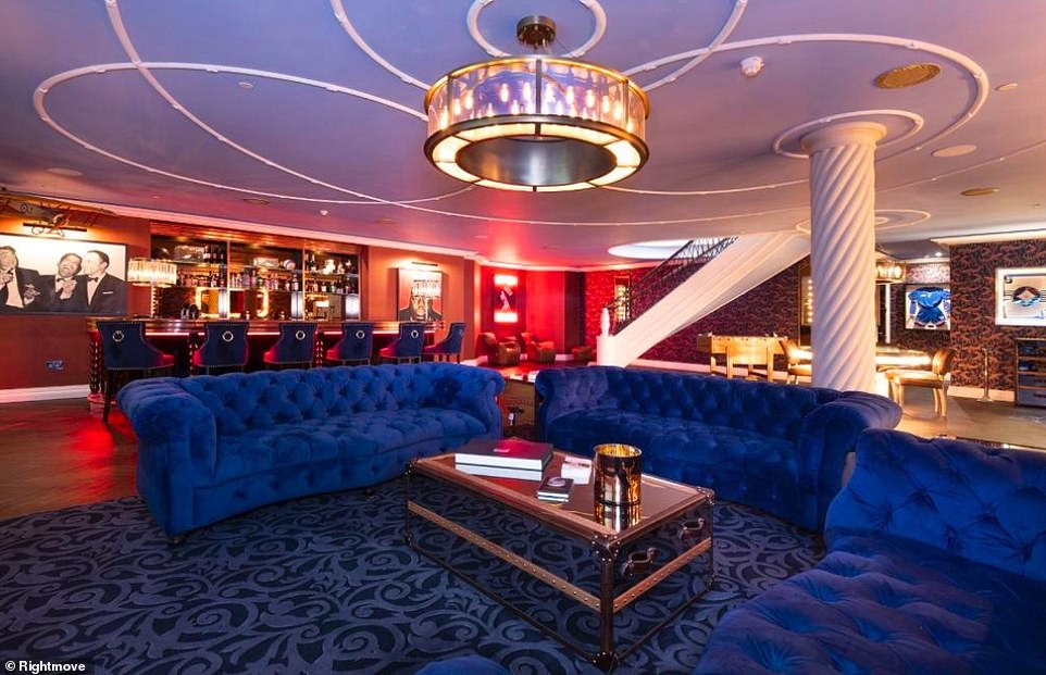 The home has a range of amenities to make living through a lockdown more manageable, with standout features including a plush bar area, games room and nine-seater cinema