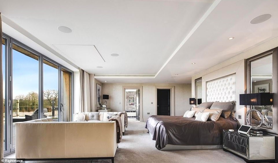 On the design side of things, the home's interiors are magazine-worthy, with swathes of marble, natural stone and glass accompanied by a largely monochrome colour scheme