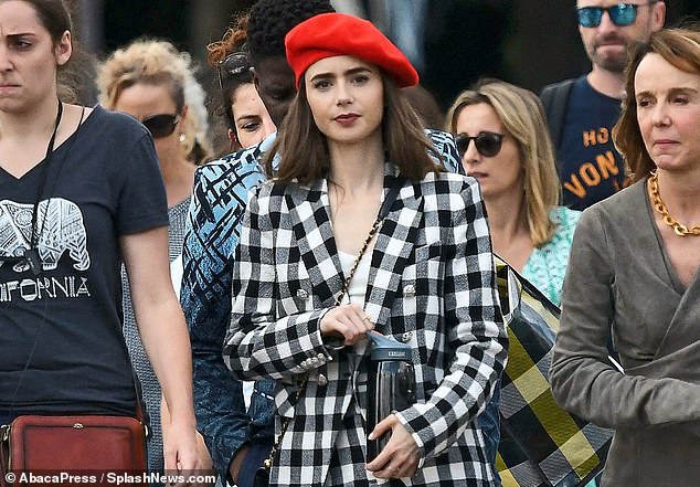 Star turn: Lily Collins stars in the Netflix hit Emily In Paris which brilliantly showcases the 'less is more' sensibility innate to so many Parisians