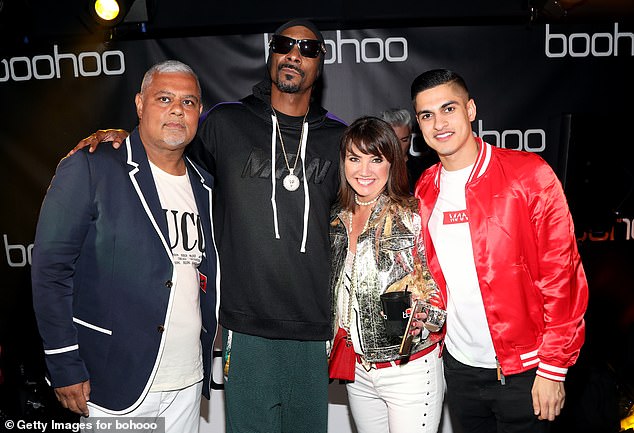 Boohoo's chairman and co-founder Mahmud Kamani (left, pictured with Snoop Dogg, Carol Kane and Samir Kamani) bought 300,000 shares at 243p each, upping his stake to 12.55%